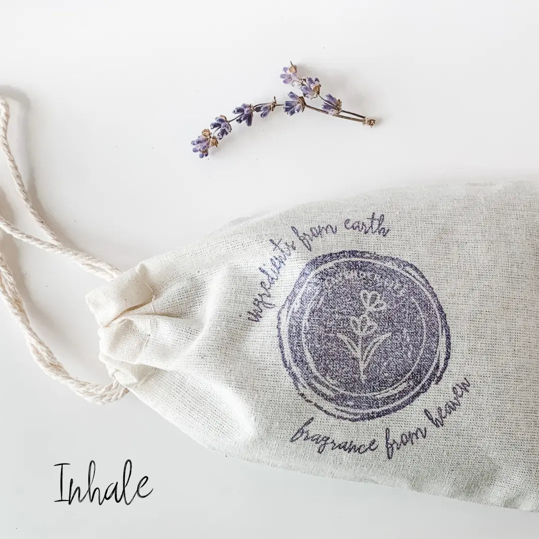 lavender sachet with tiny sprig of lavender beside it