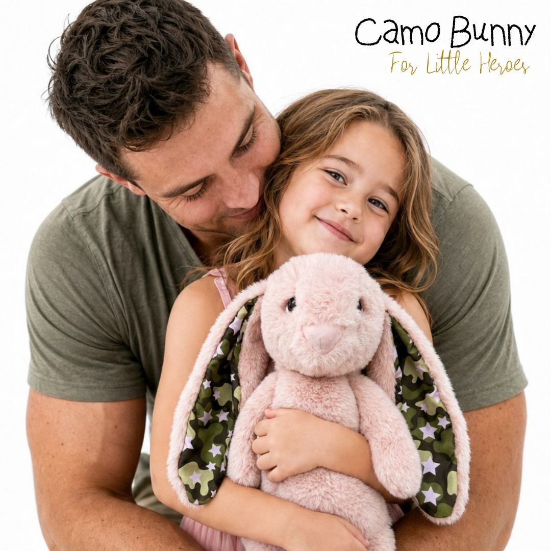 Man hugging a child holding a plush bunny with 'Camo Bunny For Little Heroes' text.