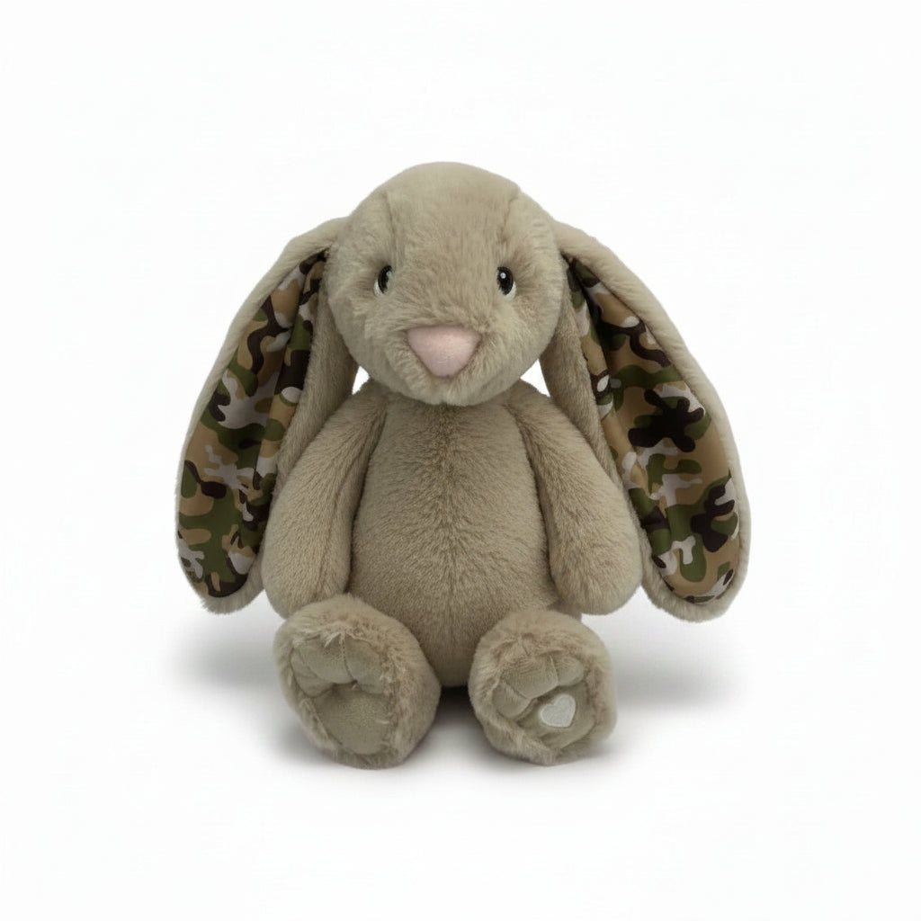 Plush toy rabbit with camouflage ears on a white background