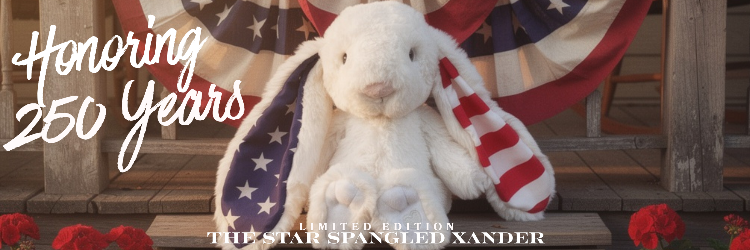 White plush rabbit with American flag design, surrounded by red flowers and wooden background with text 'Honoring 250 Years'.